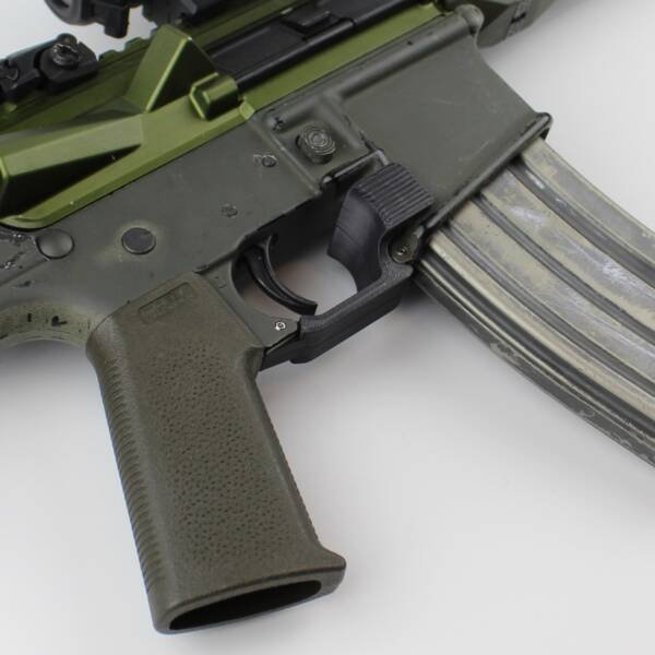 AR-15 Trigger Guard with attached ambidextrous finger rest.